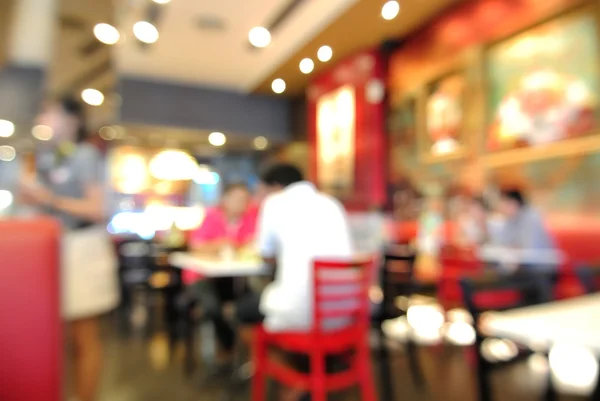Blur or Defocus Background of People eating in Restaurant