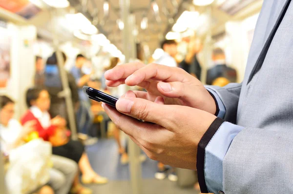 Business Man using Mobile Phone in Train — Stock fotografie