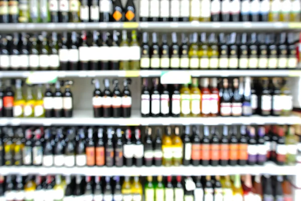 Abstract Blur or Defocus Background of Bottles of Wine on Shelf — Stock Photo, Image