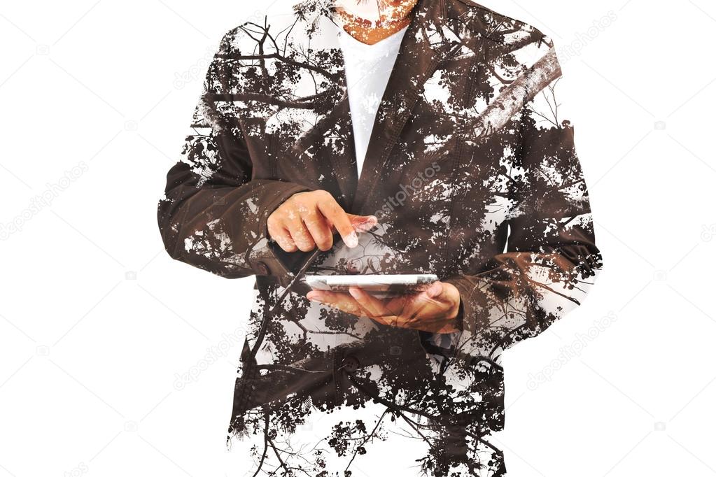 Double exposure portrait of Business man using digital tablet wi