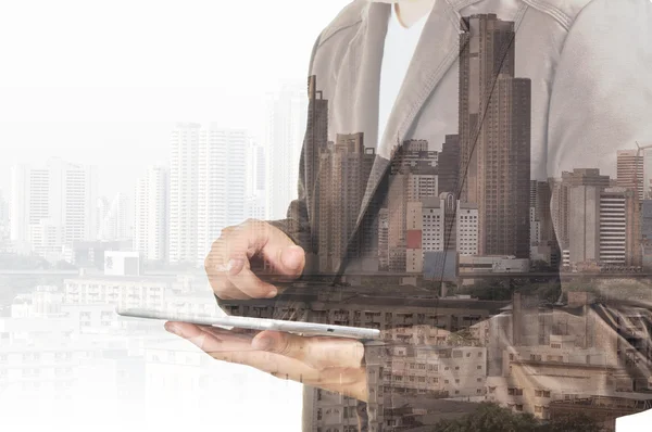 Double exposure of city and Businessman use Tablet device — Stock Photo, Image