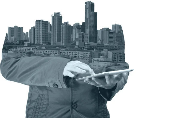 Double exposure of city and business man using digital tablet — Stock Photo, Image