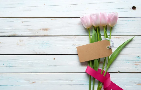 Flowers with blank gift tag