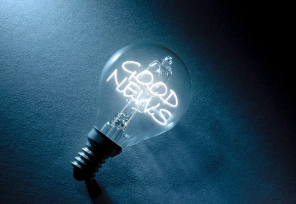 Good news light bulb — Stock Photo, Image