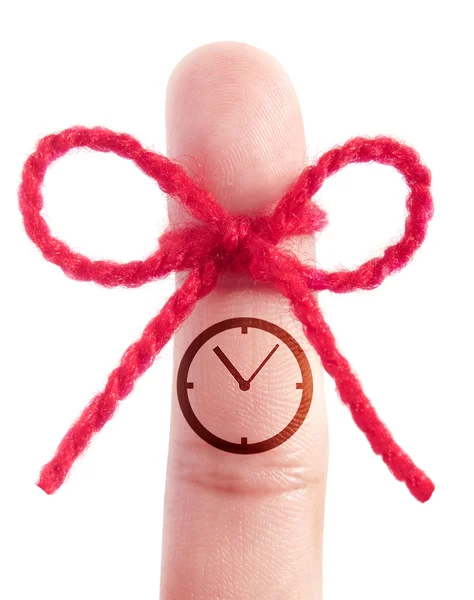 Clock icon printed on a finger — Stock Photo, Image