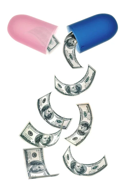 Dollar banknotes falling out of a pill — Stock Photo, Image