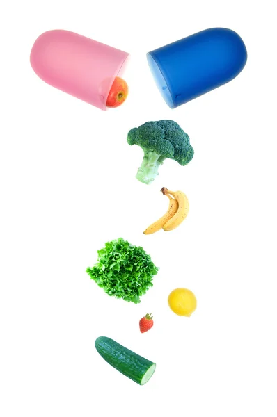 Fruit pouring out of an opened capsule — Stock Photo, Image