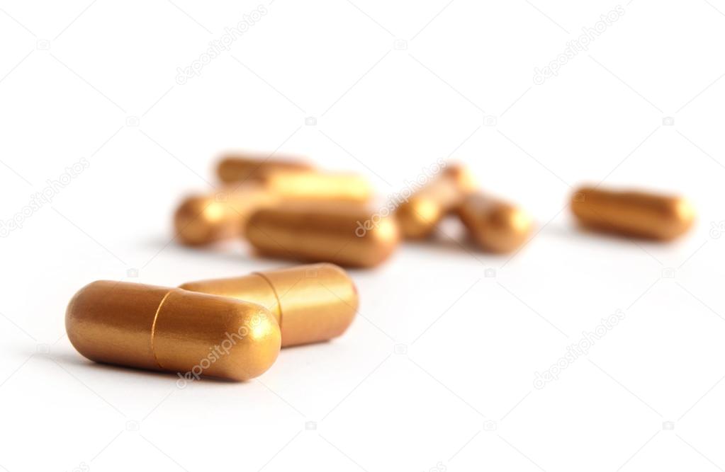 Golden medical capsules