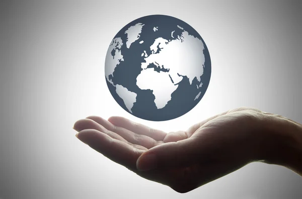 Hand holding an atlas globe — Stock Photo, Image