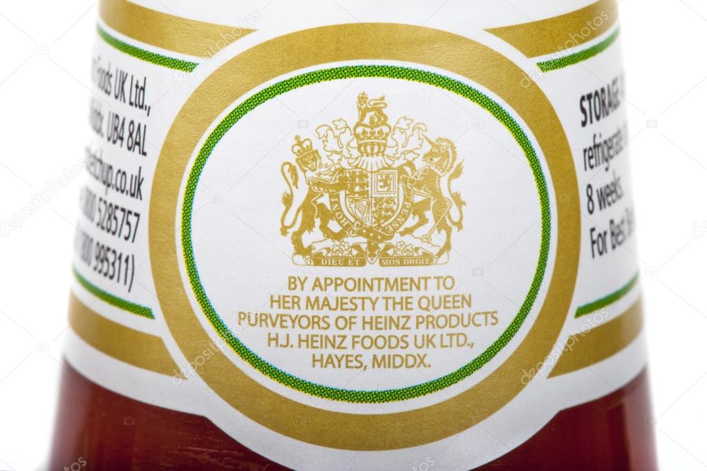 LONDON, UK - MAY 6TH 2016: A close-up of the Royal Warrant of Appointment on a jar of Heinz Tomato Ketchup isolated over a plain white background, on 6th May 2016.  Businesses who supply goods or services to Royal personages are allowed to display th