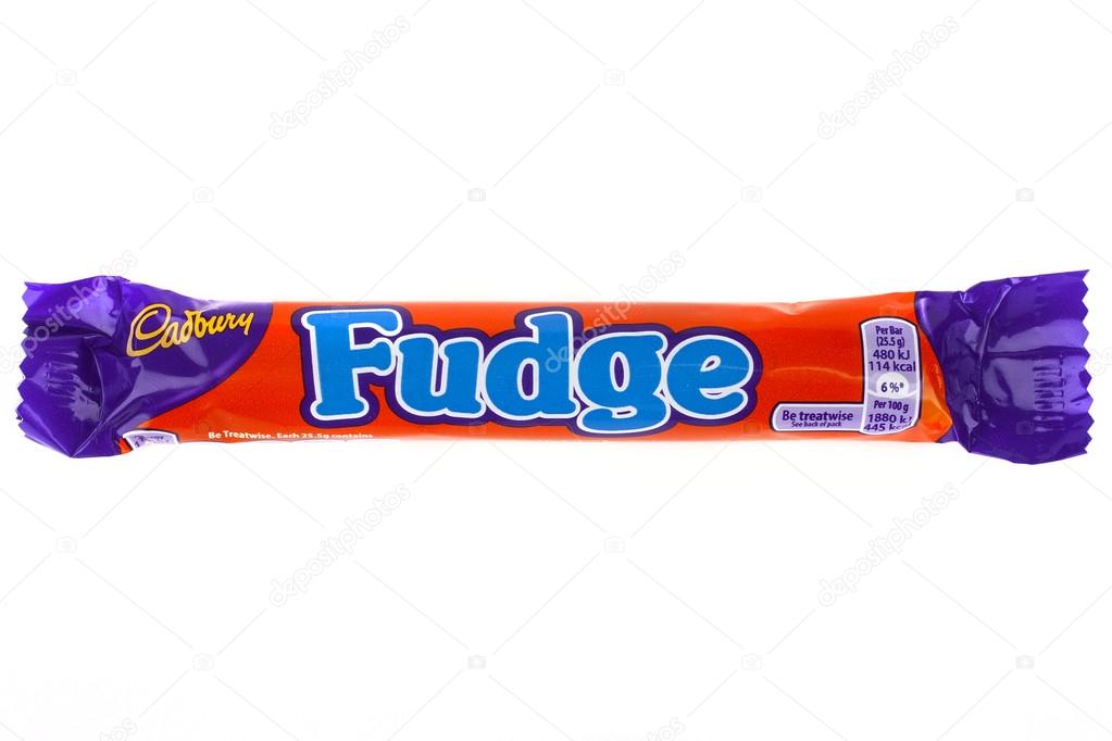 LONDON, UK - JUNE 16TH 2016: An unopened Fudge chocolate bar manufactured by Cadbury, pictured over a plain white background on 16th June 2016.