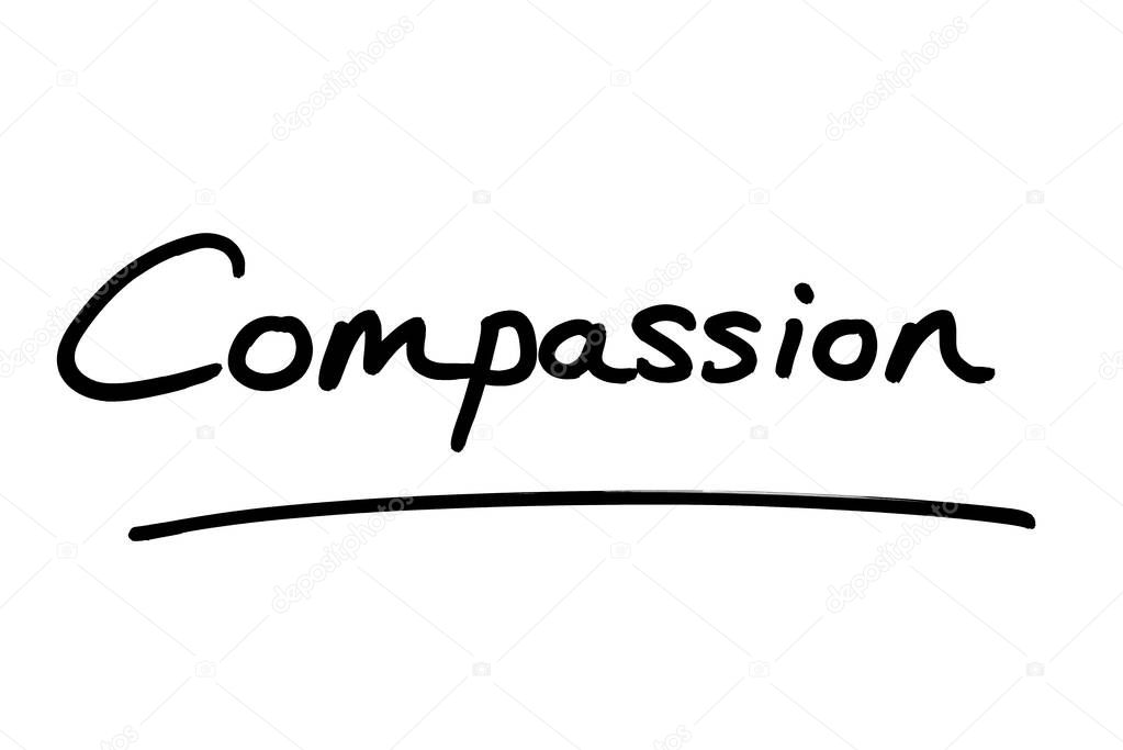 The word Compassion, handwritten on a white background.