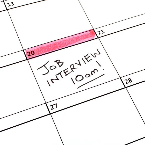 Fecha de entrevista de trabajo en un calendario — Foto de Stock