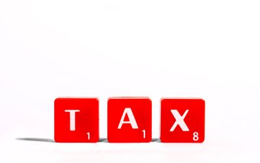 TAX spelt out with red lettered tiles clipart