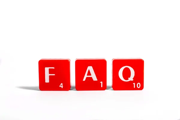 FAQ spelt out with red lettered tiles — Stock Photo, Image