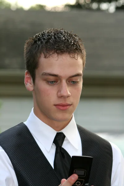 Prom Boy Looking At Cell Phone — Stock Photo, Image