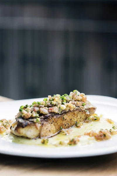 Fresh sea fish fillet with spicy salsa sauce — Stock Photo, Image