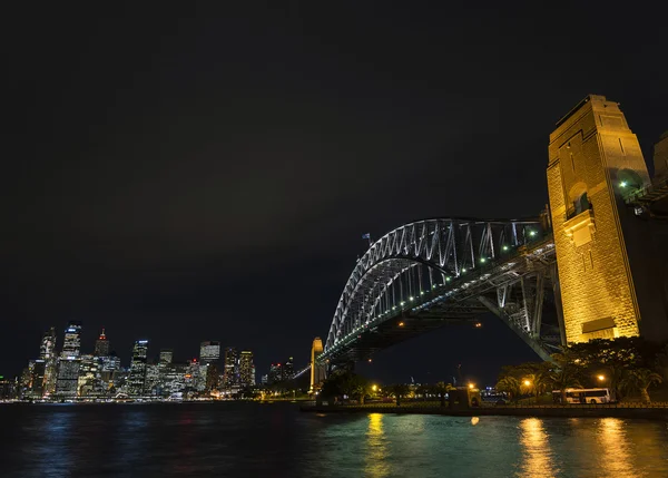 Sydney harbour bridge and skyline landmarks in australia at nigh — Stock Photo, Image