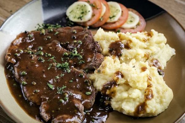 Beef steak meal with mashed potato and gravy sauce — Stock Photo, Image