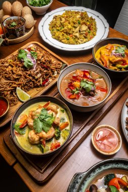 mixed traditional cuisine popular thai food dishes on bangkok restaurant table indoors