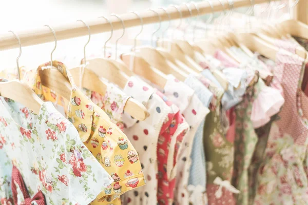 Floral pattern young girl dresses in shop — Stock Photo, Image