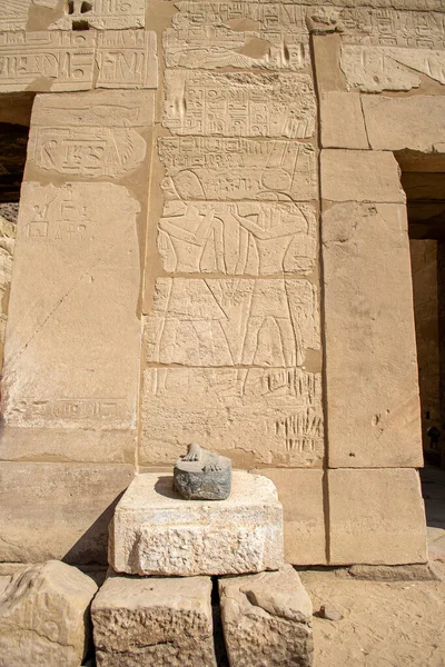 KARNAK TEMPLE - Massive columns inside beautiful Egyptian landmark with hieroglyphics, and ancient symbols. Famous landmark in the world near the Nile River and Luxor, Egypt