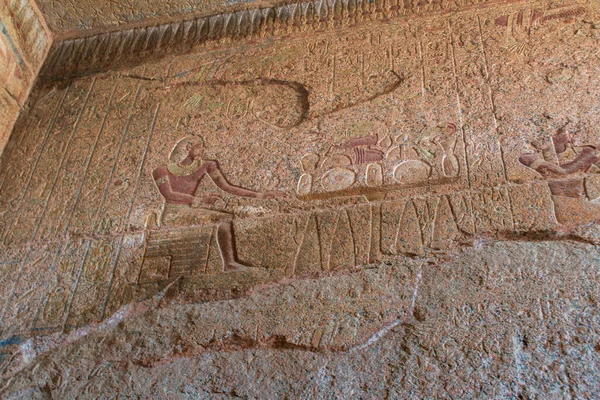 KARNAK TEMPLE - Massive columns inside beautiful Egyptian landmark with hieroglyphics, and ancient symbols. Famous landmark in the world near the Nile River and Luxor, Egypt