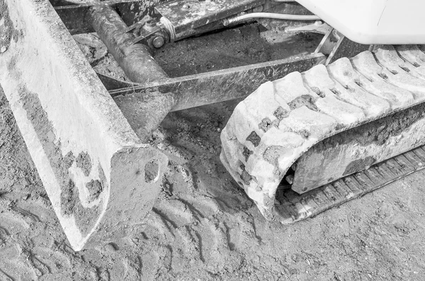 Kaivinkone kaivamaan kuoppaa — kuvapankkivalokuva