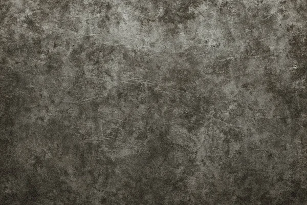 Endüstriyel Grunge Kavramı. Sert yüzeyi ve yıpranmış görünümü olan koyu desenli beton duvar.