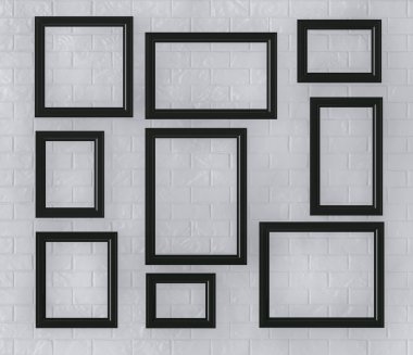 Bir tuğla duvar siyah resim çerçeveleri