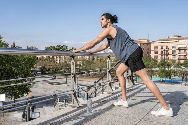 Athlete men stretching muscles after power exercise — Stock Photo, Image