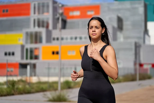 Young woman with fit body running. Female model — Stock Photo, Image