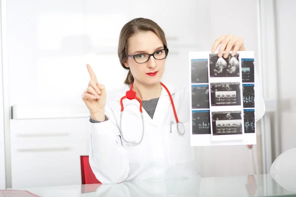 female doctor showing ultrasound