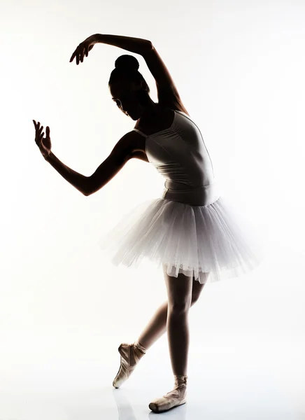 Ballerina performing a dance against a white background — Stock Photo, Image
