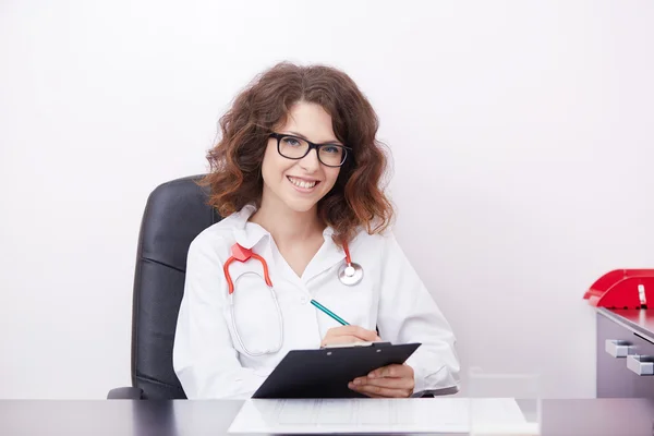 Young doctor in her office — Stock Photo, Image