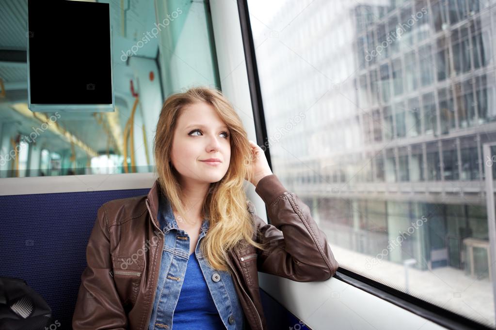 young woman riding Copenhagen metro