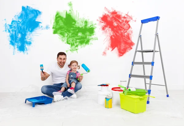 Happy family father and child daughter making repairs, paint wal — Stock Photo, Image