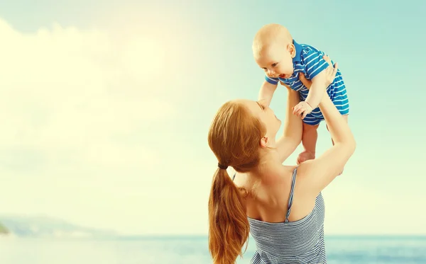 Happy family mother and baby son playing and having fun in summe — Stock Photo, Image