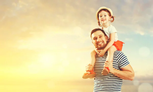 happy family father and child daughter playing and having fun in