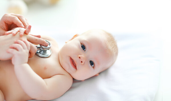 Doctor pediatrician stethoscope listening to baby