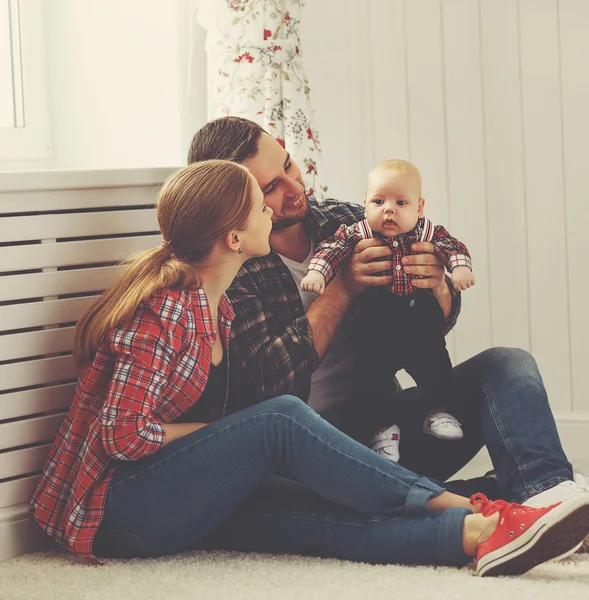 Happy family mother and father playing with a baby — Stock Photo, Image