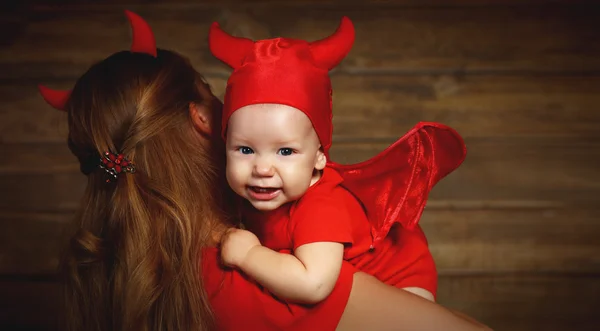 Family mother and baby son celebrate Halloween in devil costume — Stock Photo, Image