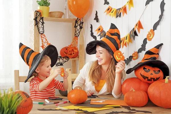 Family mother and child daughter are preparing for Halloween and — Stock Photo, Image