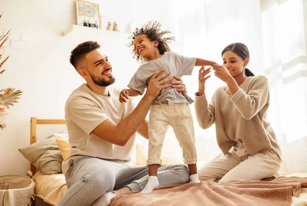 Happy Family Multiethnic Mother Father Son Laughing Playing Jumping Bed — Stock Photo, Image