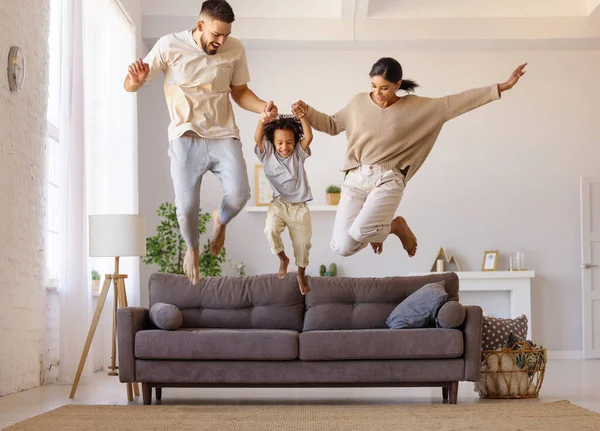 Full Body Multiethnic Father Mother Son Smiling Jumping Couch Cozy — Stock Photo, Image