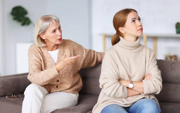 Serious Aged Mother Touching Chin Looking Depressed Adult Daughter While — Stock Photo, Image