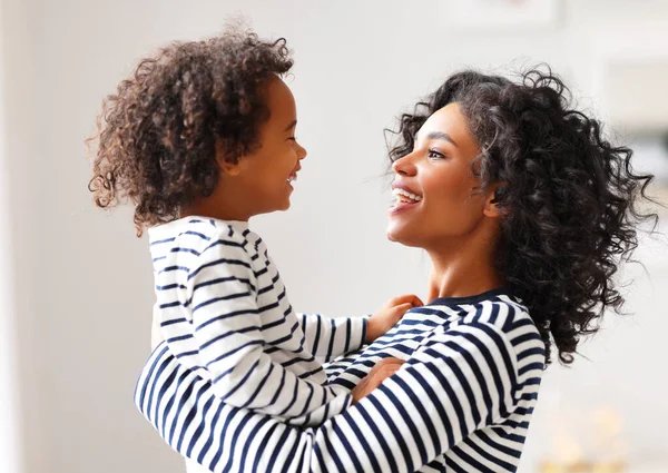Side View Delighted Ethnic Woman Smiling Carrying Cheerful Boy Curly — Stock Photo, Image