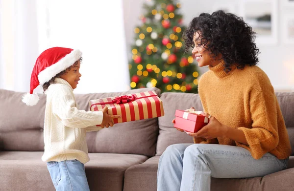 Happy Family Ethnic Woman Sitting Sofa Exchanging Gifts Boy Santa — Stock Photo, Image
