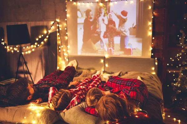 Happy Family Checkered Pajamas Mother Father Children Watching Projector Movies — Stock Photo, Image