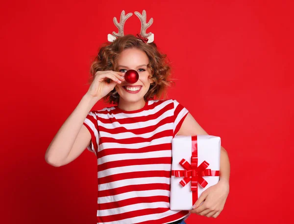 Cheerful Young Female Reindeer Antlers Smiling Camera Holding Bauble Nose — Stock Photo, Image